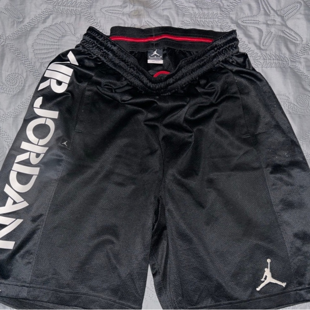Air Jordan Dri-Fit. shorts with lettering on sides.